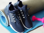 A beginner training in comfortable gym shoes during a workout, focusing on stability, support, and confident movement inside the gym.