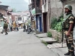 Security personnel stand guard in Doda on Friday. (ANI Video Grab)