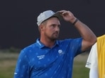 Bryson DeChambeau of the United States with his caddie Greg Bodine at the British Open Golf championships at Royal Birkdale golf club, in Southport, England, Friday, July 17.