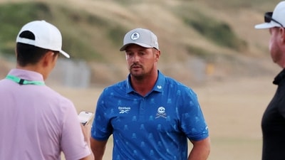 Bryson DeChambeau looks dejected on the practice range and being docked two shots in the second round of The Open. (REUTERS)