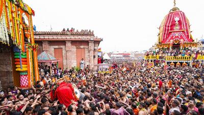 Devotees carry Lord Jagannath to the chariot while participating in the Mahaprabhu Jagannath Rath Yatra in Puri. (X)