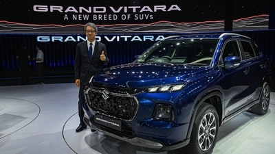 Managing Director and CEO of Maruti Suzuki India Limited (MSIL) Hisashi Takeuchi poses with the new Grand Vitara SUV during its global unveiling ceremony (Prakash Singh/AFP)