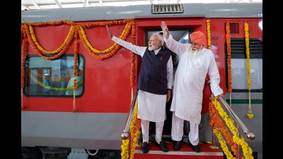 Prime Minister Narendra Modi with Sant Niranjan Dass during the flag-off of a special direct train service from Chheharta in Amritsar to Seer Govardhanpur in Varanasi. (DPR PMO) Prime Minister Narendra Modi with Sant Niranjan Dass during the flag-off of a special direct train service from Chheharta in Amritsar to Seer Govardhanpur in Varanasi. (DPR PMO)