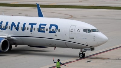 United Airlines has responded to reports that staff are providing alternative airports to passengers avoiding Donald J. Trump International Airport. (AFP Getty Images)