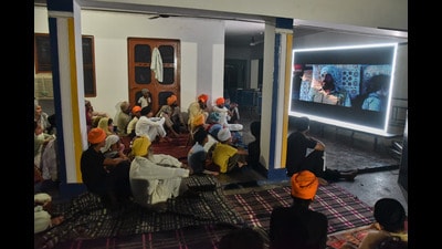 Villagers watch a special screening of the film ‘Satluj’ at a gurdwara in Tatley village in Punjab's Gurdaspur district. (AP) Villagers watch a special screening of the film ‘Satluj’ at a gurdwara in Tatley village in Punjab's Gurdaspur district. (AP)