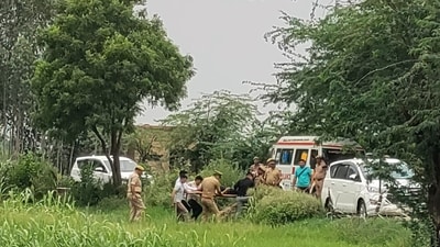 Police in Shiquabad area, Firozabad district, during an exchange of gunfire with two wanted accused. (HT photo)