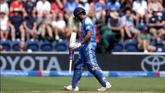 India’s Rohit Sharma walks off the pitch after being caught out by England's Jos Buttler during the second ODI. (AP)