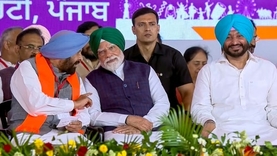 Seen here with state BJP chief Kewal Singh Dhillon, PM Narendra Modi (wearing a turban for the occasion) claimed that only the BJP, which has never held power on its own in the Sikh-majority state, will work to make Punjab developed and self-reliant, at a BJP rally in Jalandhar on Friday.