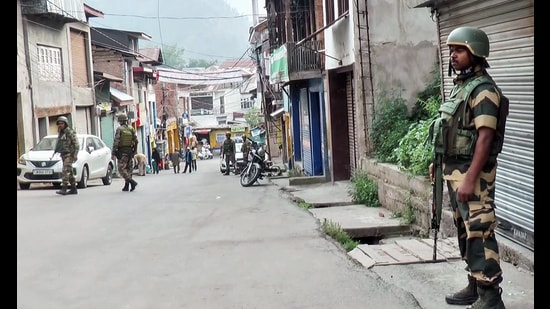 Security personnel stand guard in Doda on Friday. (ANI Video Grab)