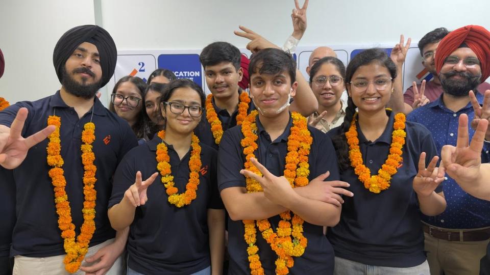 Aryan (centre) in a jubilant mood along with batch-mates after emerging as the country’s top scorer in the NEET-UG, 2026, in Ludhiana on Friday. (Gurpreet Singh/HT) Aryan (centre) in a jubilant mood along with batch-mates after emerging as the country’s top scorer in the NEET-UG, 2026, in Ludhiana on Friday. (Gurpreet Singh/HT)
