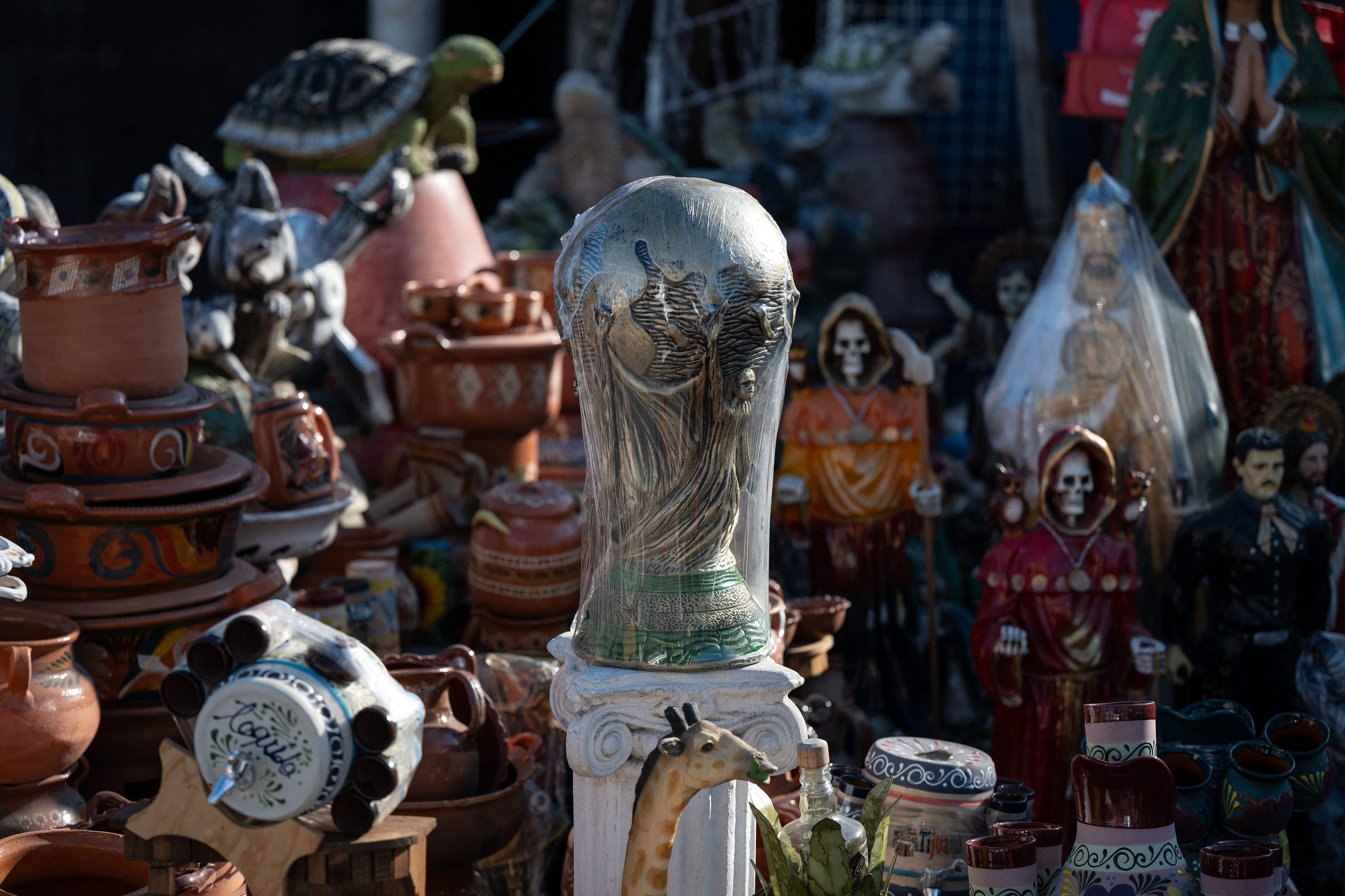 A replica of the FIFA trophy is in display for sale at the San Ysidro crossing port on the Mexican side of the border in Tijuana on June 13, 2026. (AFP) A replica of the FIFA trophy is in display for sale at the San Ysidro crossing port on the Mexican side of the border in Tijuana on June 13, 2026. (AFP)