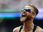 Britain's Josh Kerr celebrates after winning the men's one mile event during the IAAF Diamond League athletics competition at the London stadium in London on July 18, 2026.