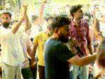 The incident briefly disrupted the programme as supporters rushed towards the stage, triggering commotion.