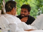 Abhijeet Dipke, founder of the Cockroach Janta Party, center, talks to climate activist Sonam Wangchuk.