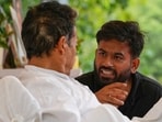 Abhijeet Dipke, founder of the Cockroach Janta Party, center, talks to climate activist Sonam Wangchuk.
