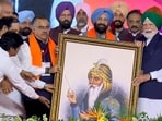 Punjab BJP chief Kewal Singh Dhillon, national general secretary Tarun Chugh and other leaders presenting a portrait of Maharaja Ranjit Singh to Prime Minister Narendra Modi in Jalandhar on Friday. (@NarendraModi)