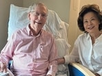 U.S. Senator Mitch McConnell (R-KY) sits with his wife, former United States secretary of labor Elaine Chao, while holding what appears to be the July 12 sports section of the Washington Post in a photograph released by his office in Washington, D.C.