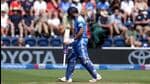 India’s Rohit Sharma walks off the pitch after being caught out by England's Jos Buttler during the second ODI. (AP)
