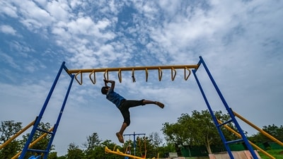 Gram it: After recording its hottest July day and night in two years on Thursday, with the maximum temperature of 39.2 degrees Celsius, Delhi is still under the heat spell. Here's how  a youngster was spotted playing at the Millennium Indraprastha Park, under a cloudy evening sky on Saturday. The IMD has forecast a generally cloudy sky for today with very light to light rain, making it a great time to enjoy the outdoors. (Photo: RAJ K RAJ /HT)