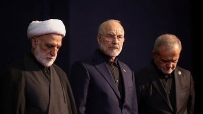 Iranian President Masoud Pezeshkian, Parliament Speaker Mohammad Baqer Qalibaf and Head of Judiciary Gholamhossein Mohseni Ejei attend a farewell ceremony for Iran's late Supreme Leader Ayatollah Ali Khamenei, who was killed on February 28 during Israeli and U.S. airstrikes on Iran, for international delegates at the Imam Khomeini Grand Mosalla in Tehran, Iran July 3, 2026. (via REUTERS)