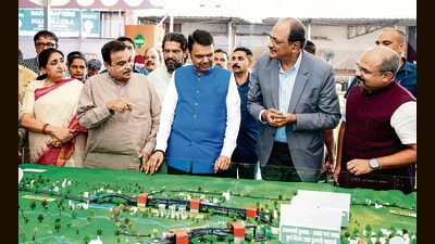 Pune, Jul 18 (ANI): Maharashtra Chief Minister Devendra Fadnavis, with Union Transport Minister Nitin Gadkari, inspects the mini models of the Pune-Shirur Upgraded Expressway, Talegaon-Chakan-Shikrapur Upgraded Expressway, and Hadapsar-Yavat Upgraded Expressway, in Pune on Saturday. State Deputy Chief Minister Sunetra Pawar and state minister Chandrakant Patil also present. (@CMOMaharashtra X)