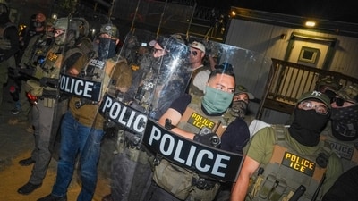 ICE agents guard Delaney Hall, a detention facility in Newark, N.J. ICE agents guard Delaney Hall, a detention facility in Newark, N.J.