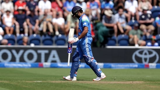 Rohit Sharma walks off the pitch after being caught out by England's Jos Buttler during the second ODI.