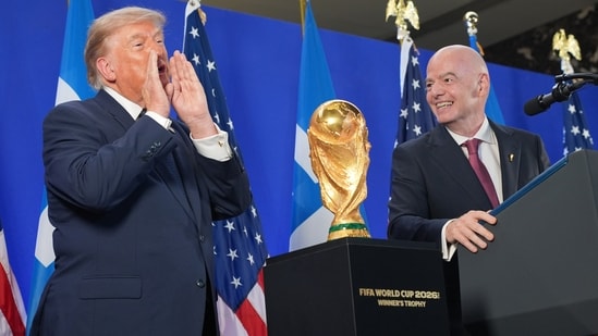 President Donald Trump and FIFA President Gianni Infantino speak at a FIFA reception event.
