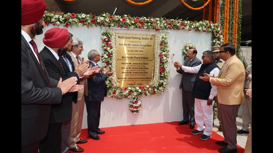 Chief Justice of India Surya Kant along with UT administrator Gulab Chand Kataria and others inaugurating multi-level parking of District Court in Sector 43, Chandigarh on Saturday. (Ravi Kumar/HT)
