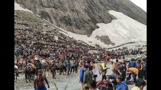 Despite the temporary halt, the pilgrimage has witnessed a strong response this year. More than 3.7 lakh devotees have paid obeisance at the holy cave shrine since the Yatra commenced. (HT File)