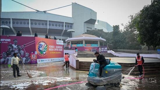Workers clean the premises of the stadium during the fourth day of YONEX-SUNRISE India Open 2026 at Indira Gandhi Sports Complex, in New Delhi, India, on Friday, January 16, 2026. (Hindustan Times)
