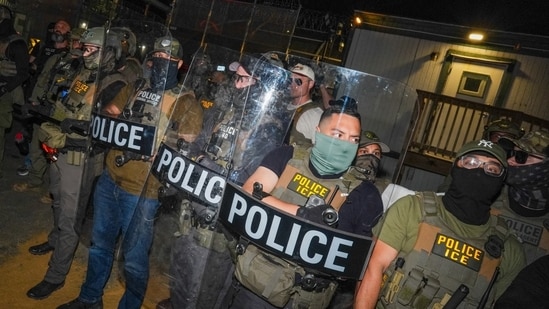 ICE agents guard Delaney Hall, a detention facility in Newark, N.J.