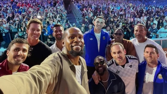 L-R: Rodri, Tom Brady, Novak Djokovic, Kevin Durant, Emiliano Martinez, Kevin Hart, Travis Scott, Michael Rubin, Rio Ferdinand, and Lionel Messi
