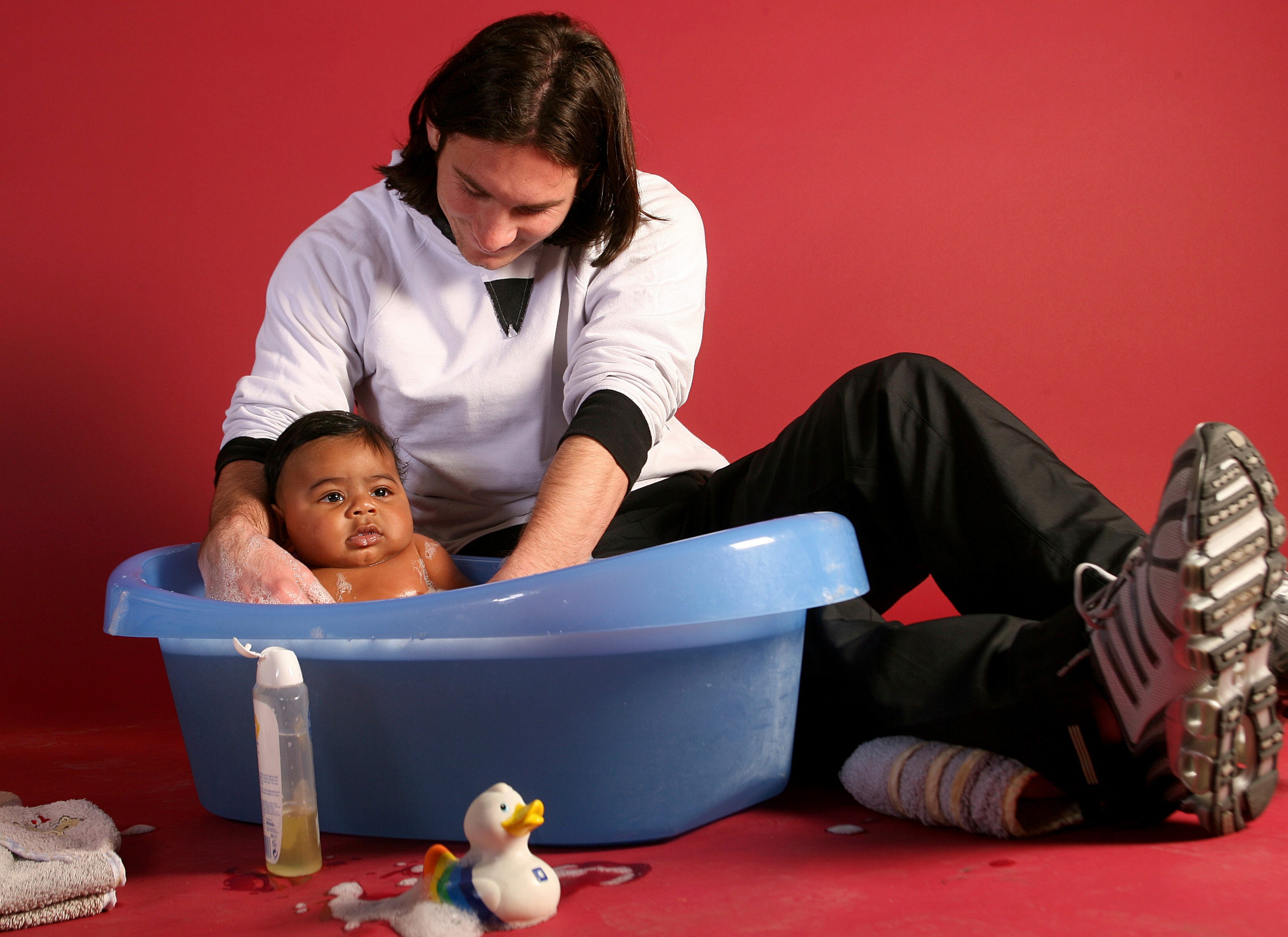 20-year-old soccer star Lionel Messi bathes baby Lamine Yamal. (AP) 20-year-old soccer star Lionel Messi bathes baby Lamine Yamal. (AP)
