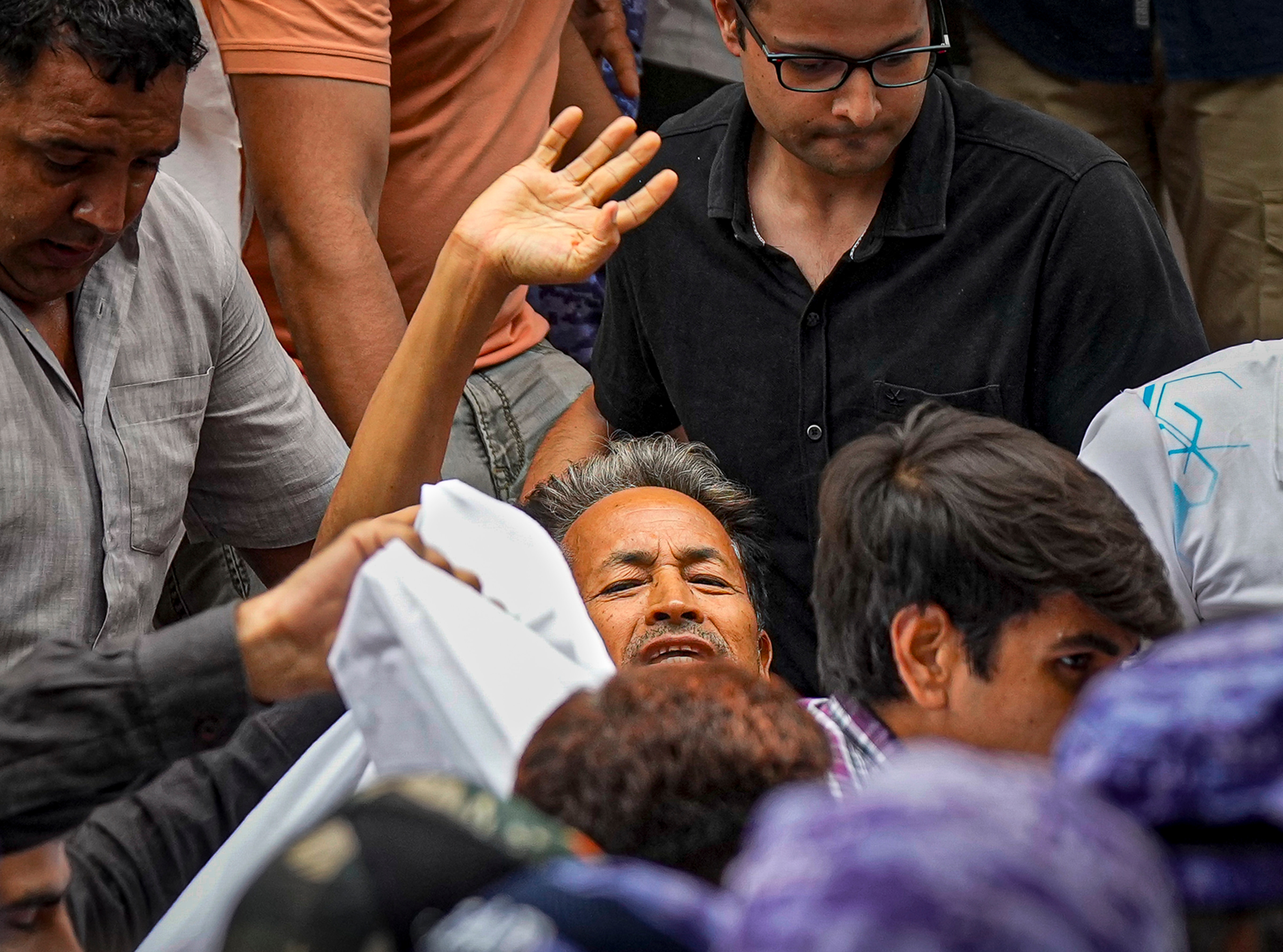 New Delhi: Activist Sonam Wangchuk, who has been on an indefinite hunger strike for 21 days, waves as he is shifted to a hospital from Jantar Mantar, in New Delhi, Saturday, July 18, 2026. (PTI Photo/Salman Ali) (PTI07_18_2026_000030B) (PTI) New Delhi: Activist Sonam Wangchuk, who has been on an indefinite hunger strike for 21 days, waves as he is shifted to a hospital from Jantar Mantar, in New Delhi, Saturday, July 18, 2026. (PTI Photo/Salman Ali) (PTI07_18_2026_000030B) (PTI)
