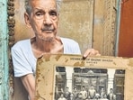 93-year-old man in Sita Ram Bazaar keeps photograph of a group portrait of a poetry club from 1911, called Bazm-e-Shaida. (Courtesy: Nancy Sardana)