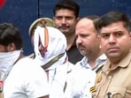 A police team takes two accused, Ram Shankar Yadav (alias Tinnu Yadav) and Manish Yadav from the district jail for 39-hour police remand in connection with the Ram temple alleged donations embezzlement case, in Ayodhya on Saturday. (ANI VIDEO GRAB)