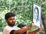 CJP founder Abhijeet Dipke with a portrait of environmentalist Sonam Wangchuk after the latter's hospitalisation