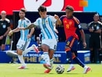 Argentina defender Lisandro Martínez (6) and Spain forward Lamine Yamal (19) vie for the ball during first half FIFA World Cup final action.