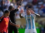 Referee Slavko Vincic, of Slovenia, shows a red card to Argentina's Enzo Fernandez (24) during the World Cup final soccer match between Spain and Argentina in East Rutherford, N.J., near New York, Sunday, July 19, 2026. (AP Photo/Frank Franklin II)