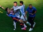 Spain's Gavi falls as he scuffles with Argentina's Leandro Paredes (5) and Thiago Almada after World Cup final.