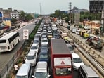 At least five ambulances were caught in the traffic jam. Authorities diverted vehicles via KMP Expressway, Sohna Road and SPR. (HT)