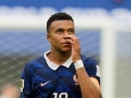 Kylian Mbappe walks off the pitch after the World Cup third-place playoff match.