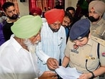 Police officials interacting with locals during a district- level solution camp in Khanna on Saturday. (HT PHOTO)