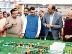 Pune, Jul 18 (ANI): Maharashtra Chief Minister Devendra Fadnavis, with Union Transport Minister Nitin Gadkari, inspects the mini models of the Pune-Shirur Upgraded Expressway, Talegaon-Chakan-Shikrapur Upgraded Expressway, and Hadapsar-Yavat Upgraded Expressway, in Pune on Saturday. State Deputy Chief Minister Sunetra Pawar and state minister Chandrakant Patil also present. (@CMOMaharashtra X)