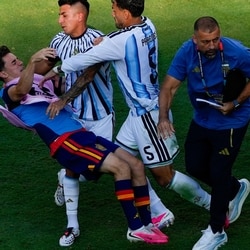 Spain's Gavi falls as he scuffles with Argentina's Leandro Paredes (5) and Thiago Almada after World Cup final.