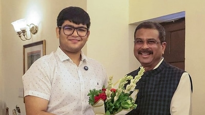 Union Education Minister Dharmendra Pradhan with Panchul Bansal from Haryana, who secured AIR 2 in NEET-UG 2026, in New Delhi on Sunday. (Photo: X/@dpradhanbjp/ANI Photo) Union Education Minister Dharmendra Pradhan with Panchul Bansal from Haryana, who secured AIR 2 in NEET-UG 2026, in New Delhi on Sunday. (Photo: X/@dpradhanbjp/ANI Photo)