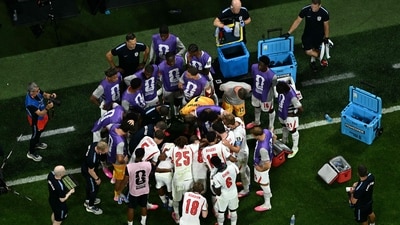 England's players huddle during a hydration break. (AFP) England's players huddle during a hydration break. (AFP)