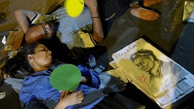 CJP supporters rest during a protest demanding Union Education Minister Dharmendra Pradhan's resignation over alleged irregularities in the NEET examination, at the Jantar Mantar. (PTI) CJP supporters rest during a protest demanding Union Education Minister Dharmendra Pradhan's resignation over alleged irregularities in the NEET examination, at the Jantar Mantar. (PTI)