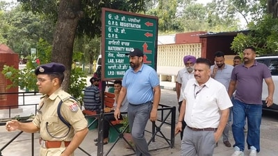 Punjab Police inspector Gurinderjit Singh Nagra (in black cap) being taken to hospital for a checkup at Dasuya after his arrest on Saturday. He has been remanded in three days’ police custody. (HT photo) Punjab Police inspector Gurinderjit Singh Nagra (in black cap) being taken to hospital for a checkup at Dasuya after his arrest on Saturday. He has been remanded in three days’ police custody. (HT photo)